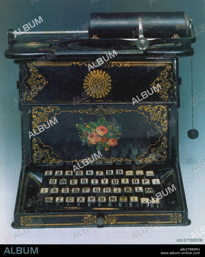 Typewriter. The 1873 Sholes and Glidden typewriter show the type bars arranged in a circle. The QWERTY keyboard design is similar to that used today.