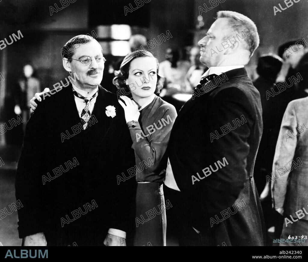 JOAN CRAWFORD, LIONEL BARRYMORE and WALLACE BEERY in GRAND HOTEL, 1932, directed by EDMUND GOULDING. Copyright M.G.M.