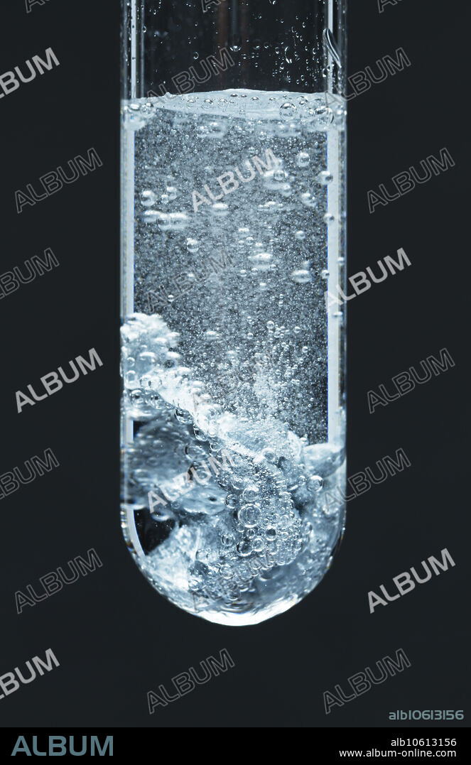 Zinc reacts with an acid. Zinc metal (Zn) reacts with 3M sulfuric acid (H2SO4) in a test tube. The reaction produces hydrogen gas (H2) bubbles: Zn + H2SO4 -> ZnSO4 + H2. This is an example of a single displacement reaction.