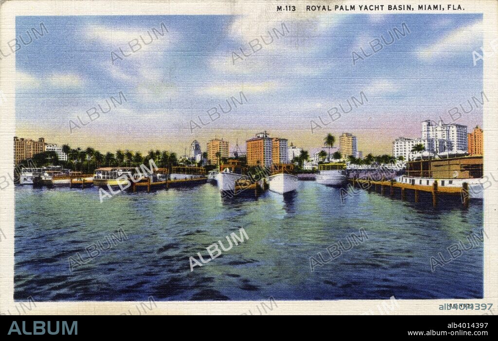 Royal Palm Yacht Basin, Miami, Florida, USA, 1933. Vintage linen postcard. Boats are docked at the piers and the city skyline is in the background.