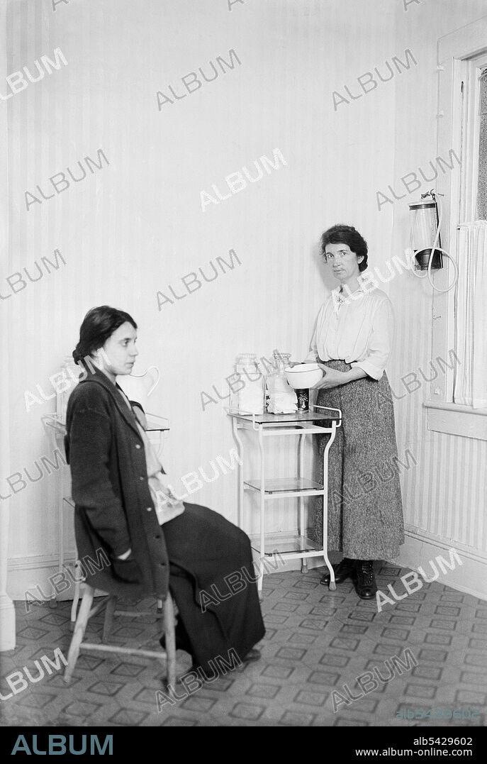 Birth Control activist Margaret Sanger (1879-1966) with Fania Mindell inside Birth Control Clinic, Brownsville, Brooklyn, New York, USA, Bain News Service, 1916.
