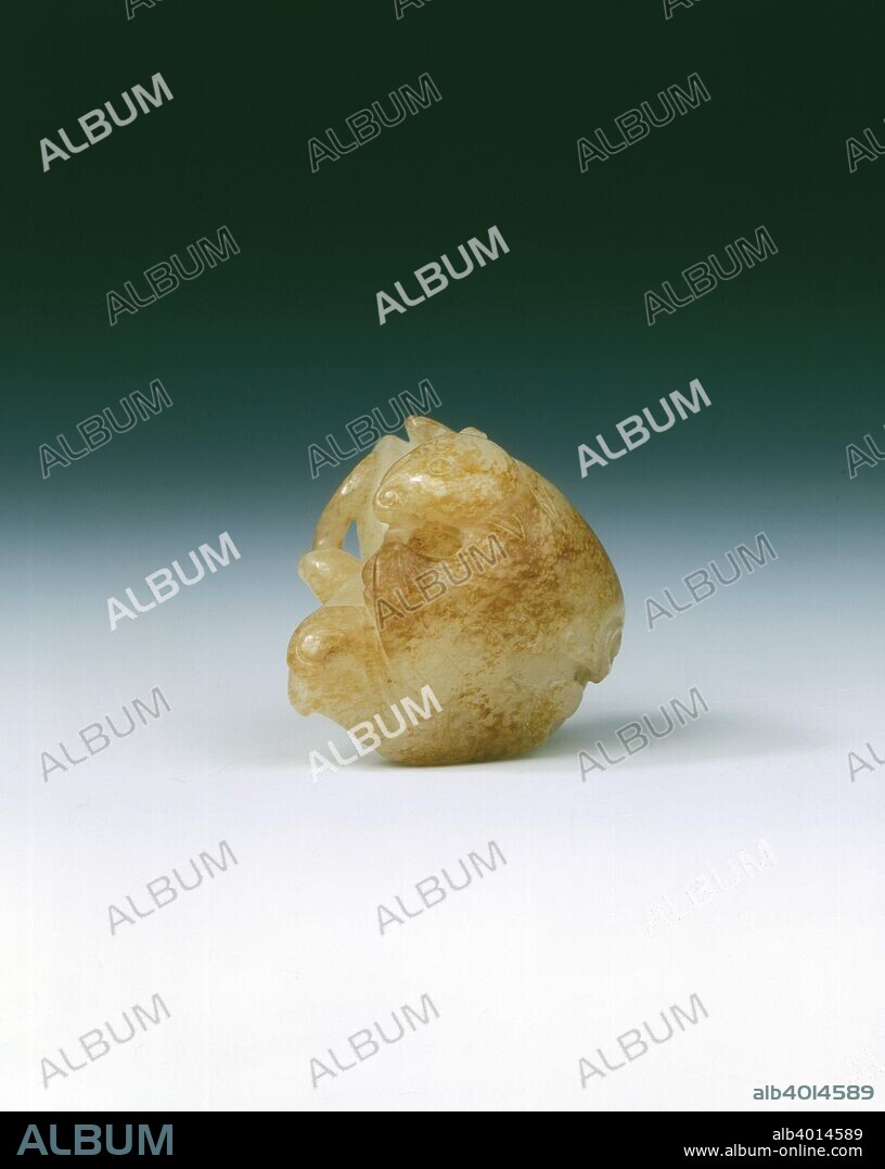 Jade rebus of bat and water caltrop, early Qing dynasty, probably Kangxi period, China, 1644-1722. A jade pebble group of a water caltrop with leaves and stem, on top of which is a bat enveloping almost the entire top of the fruit, light brown suffusions. This combination of plant and animal creates a rebus, the meaning of which is 'With prosperity comes intelligent use of opportunities'. The combination of animals or animals with plants to make a rebus was very popular from Song dynasty on.