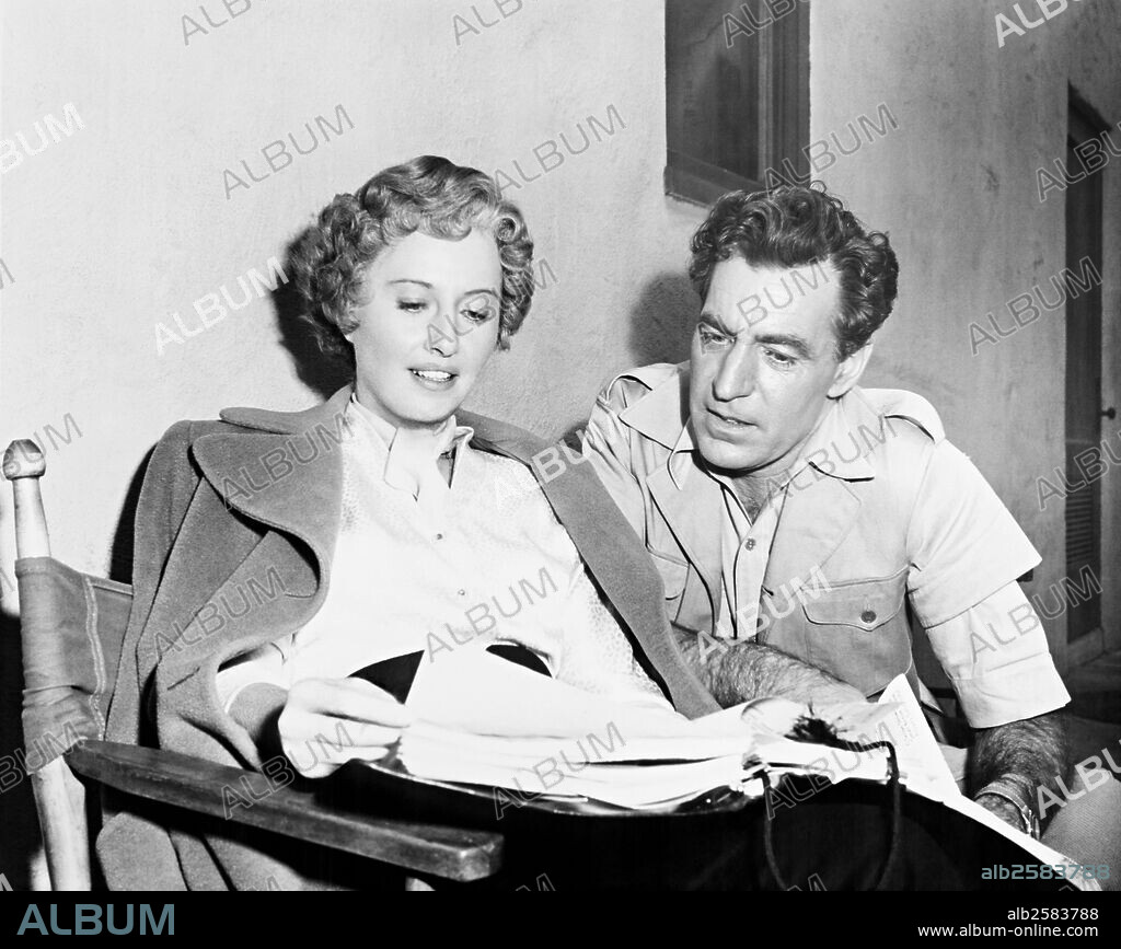 BARBARA STANWYCK and DAVID FARRAR in ESCAPE TO BURMA, 1955, directed by ALLAN DWAN. Copyright RKO.