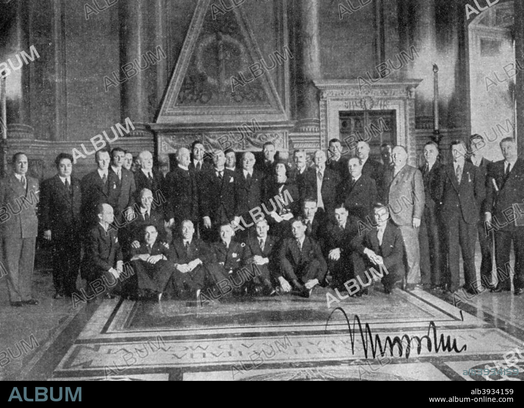 Il Duce poses, FA tour, Palazzo di Venezia, Rome, Italy, 1933. Fifth from the right is Arsenal FC manager Herbert Chapman (1878-1934), and standing on Mussolini's (1883-1945) right is Sir Frederick Wall, Secretary of the FA. The photogaph is signed by Mussolini. A print from Football Ambassador by EA (Eddie) Hapgood, Sporting Handbooks LTD, London, 1945.