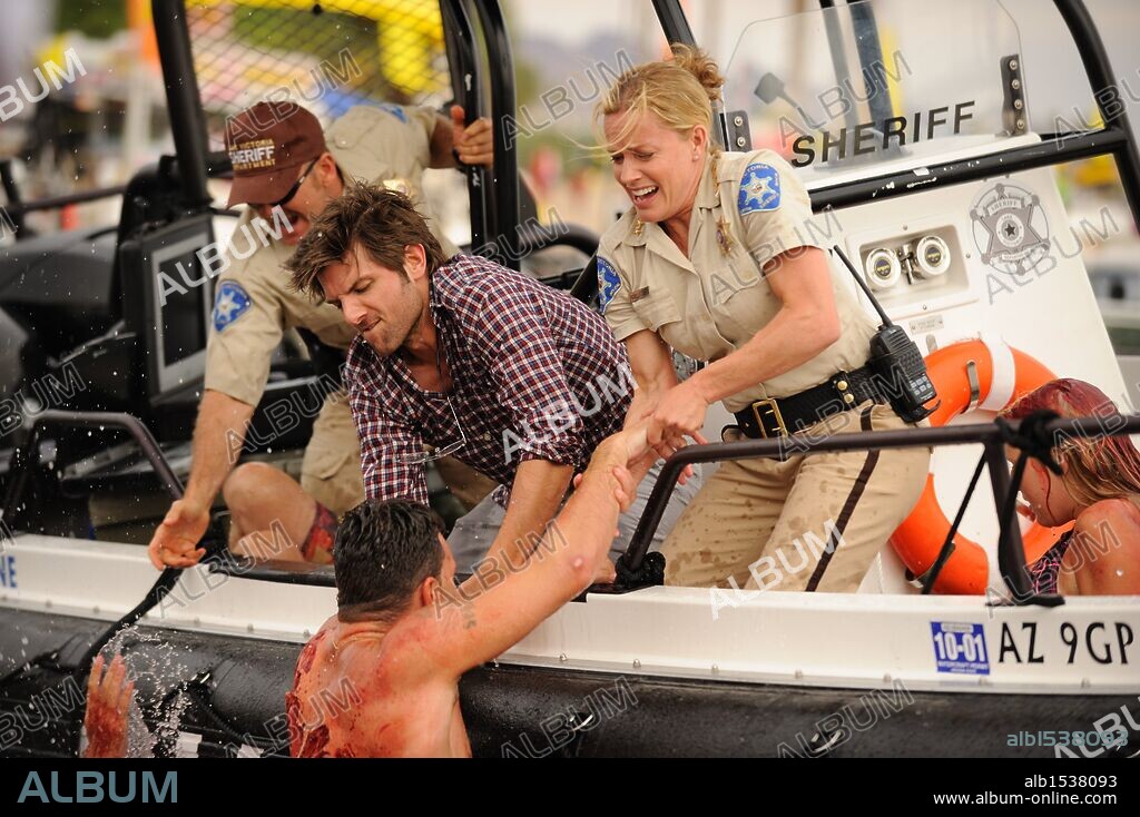 ADAM SCOTT and ELISABETH SHUE in PIRANHA, 2010 (PIRANHA 3D), directed by ALEXANDRE AJA. Copyright DIMENSION FILMS.