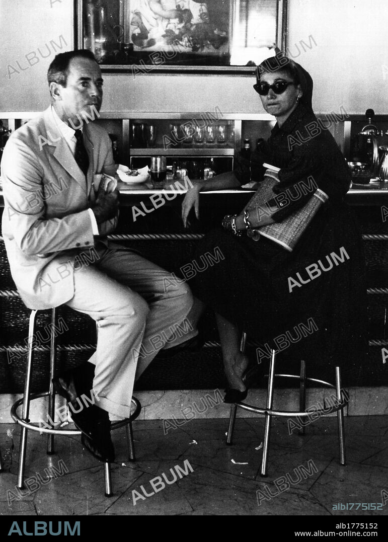 Henry Fonda with his wife Afdera in Rome. The American actor Henry Fonda and his wife Afdera Franchetti sitting in a bar in via Veneto in Rome. Rome, 1950s.
