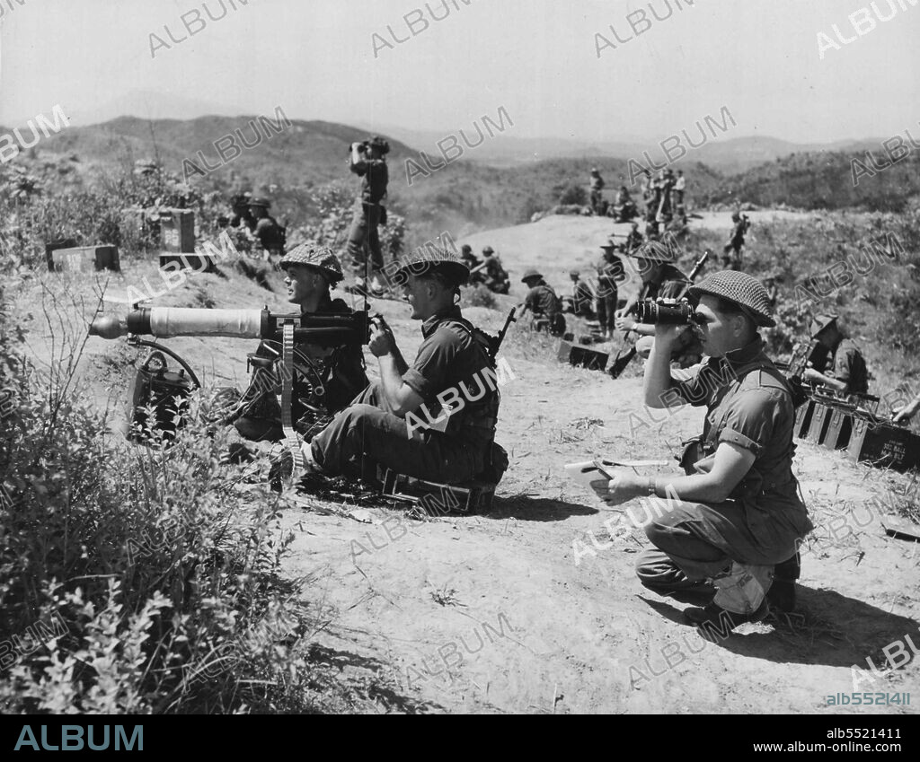 The heavy Vickers machine gun has been used in two world wars, but it's still a favoured infantry weapon. Here a Vickers team of the First Battalion Royal Australian Regiment goes into action during a competition shoot in Korea. The Diggers were competing against other units serving with the first Commonwealth Division. They showed that they can handle the guns as well as their fathers and grandfathers did by winning the competition easily. June 07, 1955. (Photo by Britcom PR Photo).