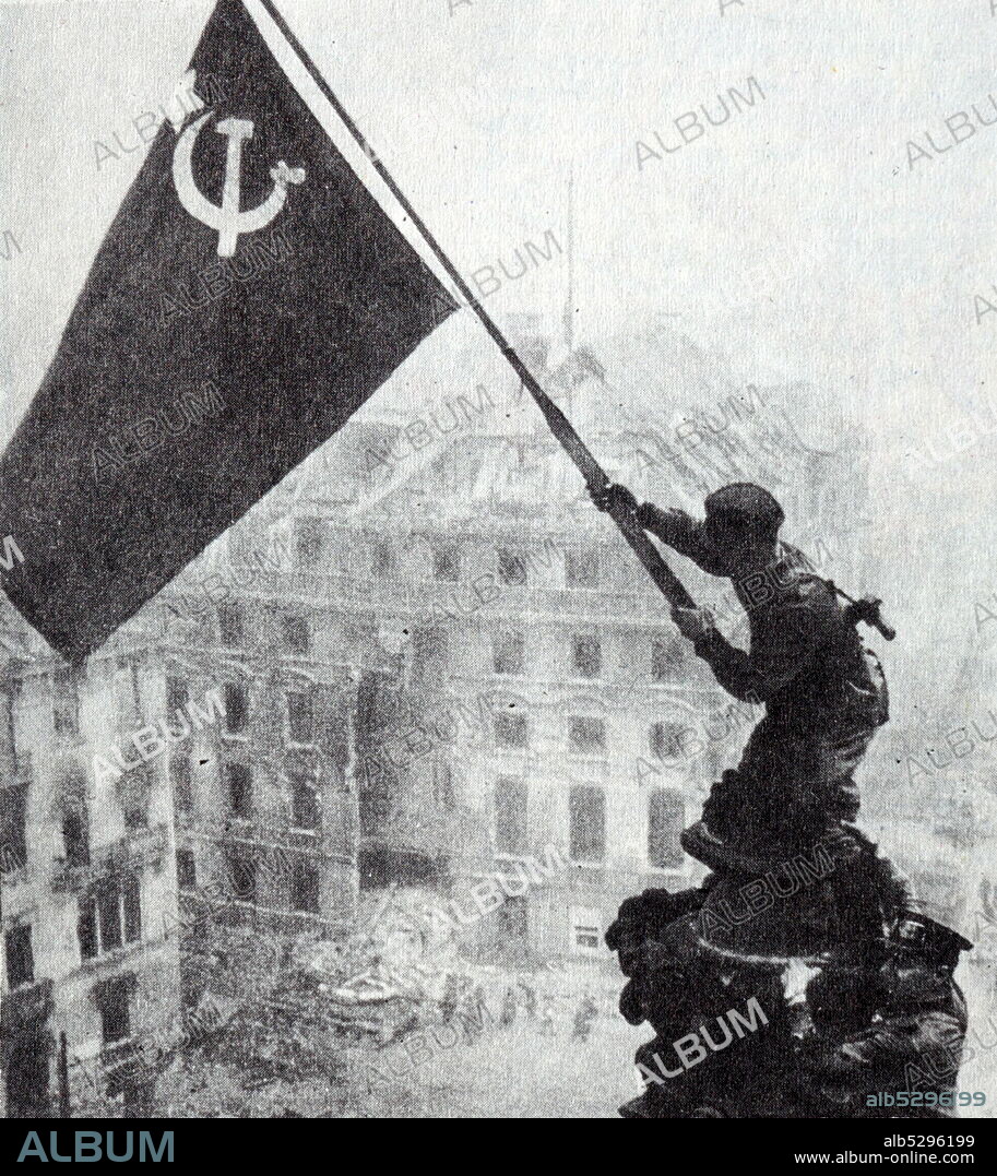 Banner of Victory over Reichstag in Berlin. Soviet troops wave red flag over Berlin at the end of World War Two.