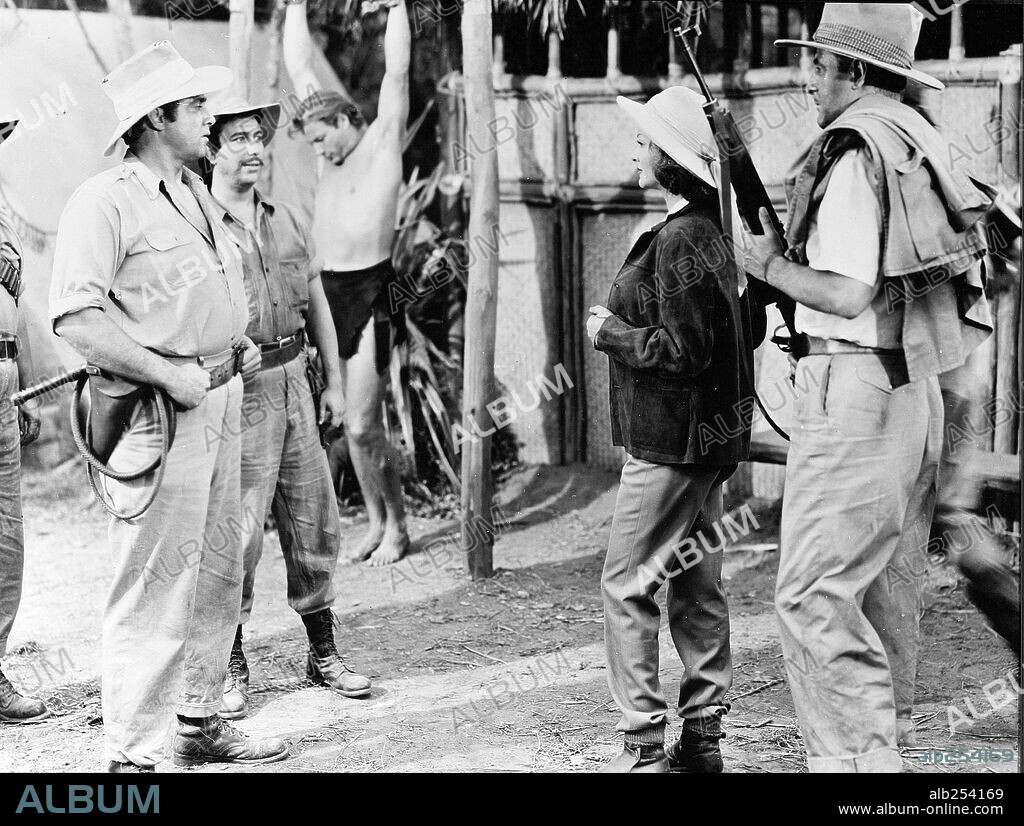 LEX BARKER, MONIQUE VAN VOOREN and RAYMOND BURR in TARZAN AND THE SHE-DEVIL, 1953, directed by KURT NEUMANN. Copyright RKO.