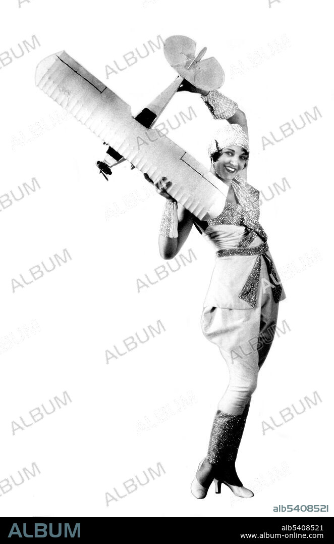Ruth Elder (September 8, 1902 - October 9, 1977) was an aviation pioneer and actress, known as the Miss America of Aviation. She was a charter member of the Ninety-Nines. In 1927 she took off from New York in the airplane American Girl, George Haldeman as her pilot, in an attempt to become the first woman transatlantic airplane rider. Mechanical problems caused them to ditch the plane 360 miles from land, but they established a new over-water endurance flight record of 2,623 miles. It was also at the time the longest flight ever made by a woman. She and George were honored with a ticker-tape parade upon their return. After her flight, she embarked on a series of lucrative speaking engagements and was given a movie contract. She starred in Moran of the Marines (1928) and The Winged Horseman (1929). In 1929 she entered the first Women's Air Derby, flying in her Swallow, NC8730, and placed fifth. She worked as an executive secretary in the aviation industry in her later career, hired by Howard Hughes. She married six times. She had suffered emphysema for several years before she died in 1977, at the age of 75. No photographer credited, 1920s.