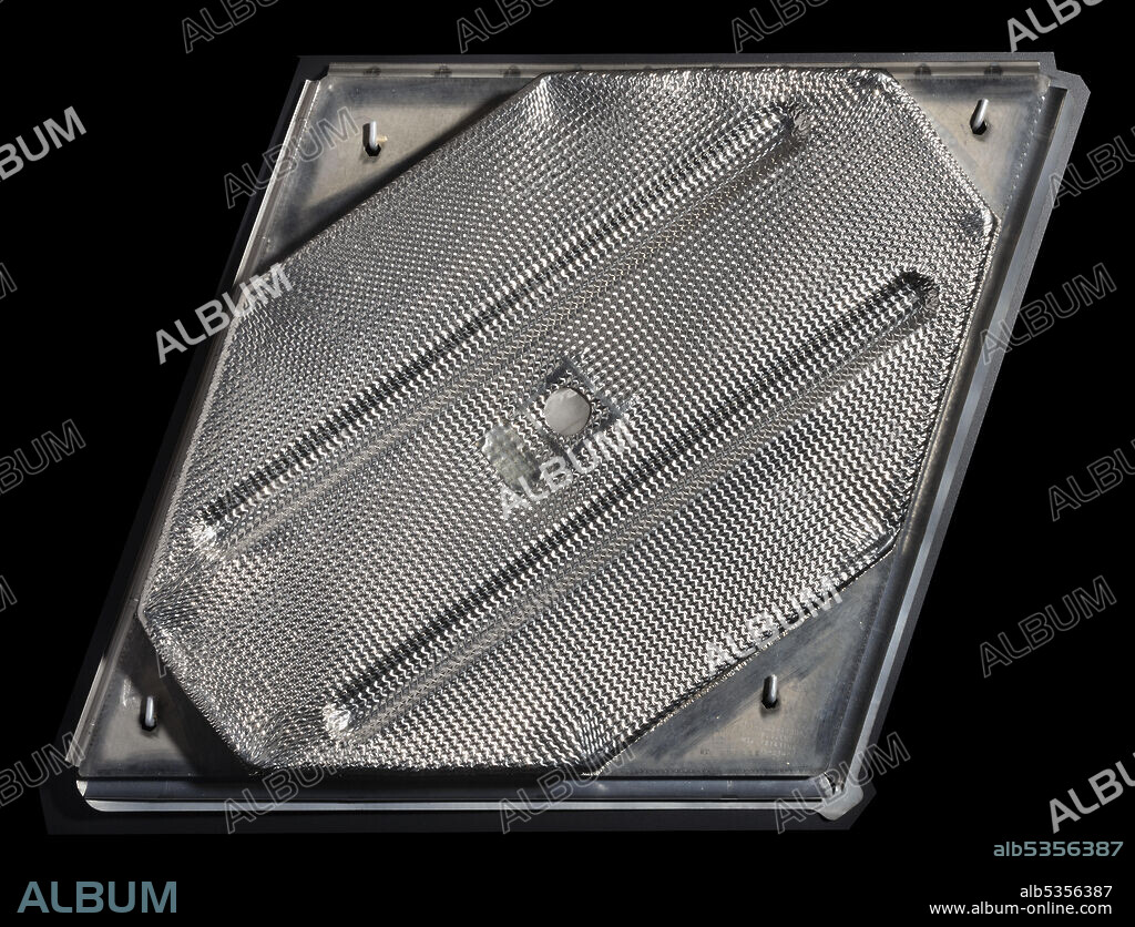 B. F. GOODRICH COMPANY. This metallic heat shield panel was made for the X-33 reusable launch vehicle research project that NASA and Lockheed carried out from 1996-2001. The purpose of the project was to evaluate technologies for a successor vehicle to the Space Shuttle. Researchers targeted the thermal protection system for improvement and innovation, seeking a more durable and more easily installed heat shield that would require less maintenance than Shuttle tiles. This lightweight metallic heat shield panel, made of Inconel and titanium, would lock together with others to form an armor layer on the vehicle. Such a metallic shield was deemed a viable alternative to ablative shields or ceramic tiles. However, NASA shelved this approach to thermal protection when it cancelled the X-33 project, and the Museum acquired a sample panel for its heat shield collection.