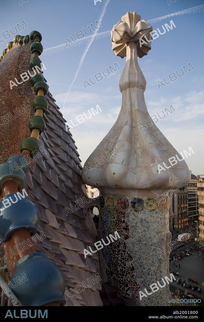 Casa Batllo was built in the year 1877 and remodeled by Antonio Gaudi in the years 1905-1907 for the Batllo family, living in the first floor. Because of the curved roof and skeletal organic quality, the local name for the building is House of Bones or House of the Dragon. A common theory is that the house represents the battle of Saint George with the dragon. The building is decorated in  Modernisme style, with a mosaic made of broken ceramic tiles in shades of orange, green and blue. The building was awarded as one of the three best buildings of the year 1906 by the Barcelona City Council; Batllo House is one of the seven works of Gaudi that were declared World Heritage sites by UNESCO in 1984. Along with Casa Ametllar and Casa Lleo-Morera, it makes up the three most important buildings in Barcelona's famous "Illa de la Discordia" ("Block of Discord") [formerly known as "Apple of Discord" (manzana de la Discordia)], noted for its unique modernist buildings.