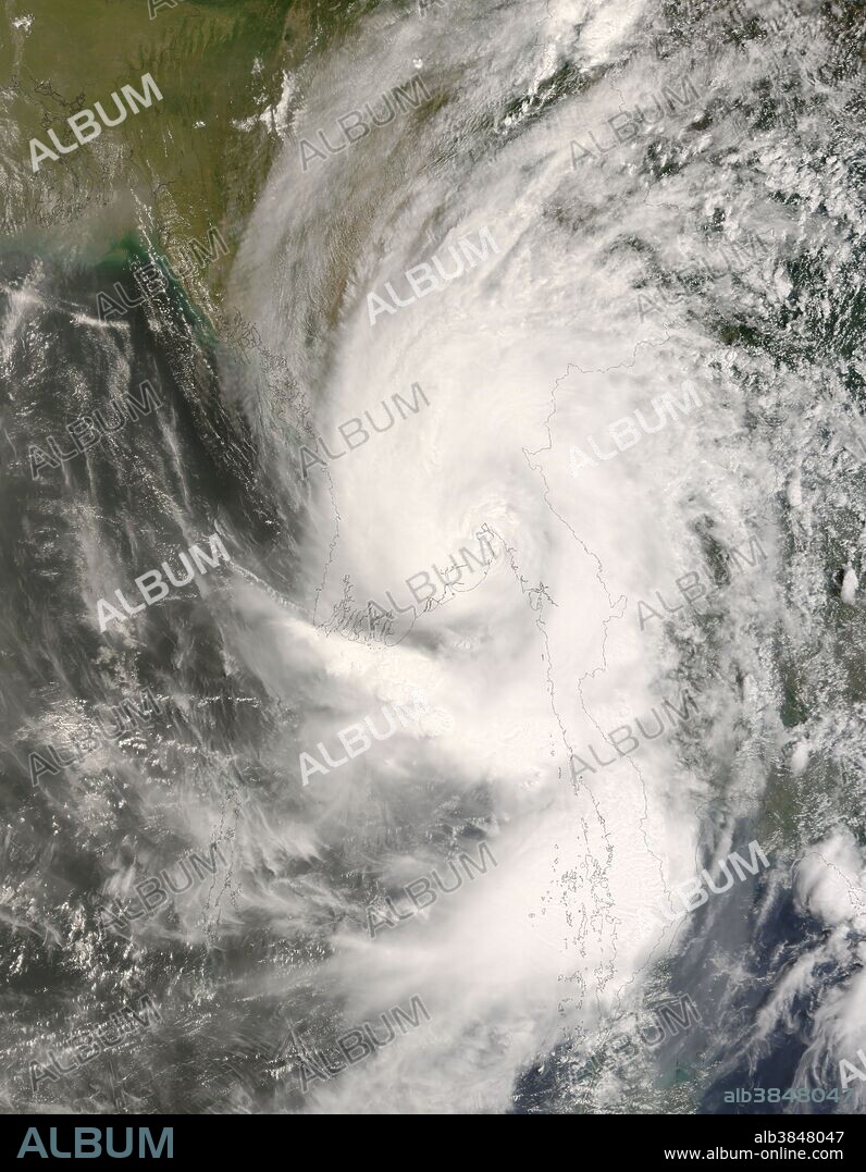 In early May 2008, Cyclone Nargis passed over Myanmar (Burma) after forming in the Bay of Bengal. At one point, Nargis was a Category 4 cyclone, with sustained winds of 210 kilometers per hour (130 miles per hour), according to Unisys Weather. This satellite view of the storm was acquired by the Moderate Resolution Imaging Spectroradiometer (MODIS) on NASA's Terra satellite. Ragged lines of thunderstorms peek up above the other clouds in a number of areas, casting shadows on lower lying clouds, evidence of intense rain systems within the storm. By the time MODIS acquired this image on May 3 at 10:55 am local time (4:25 UTC), the cyclone had weakened to tropical storm strength. While the spiral structure is still evident, the eye is poorly defined, and clouds fill the space the between spiral arms, characteristics of a less-powerful tropical storm. The typhoon lost strength before coming ashore on May 2, but it still carried very powerful winds and heavy rain. The storm's path took it almost directly over Yangon, a city with a population of more than 4 million. Extensive flooding along the coastal plains where the storm passed were clearly seen in satellite imagery taken just after the storm passed. News reports on May 9 stated that as many as 100,000 people were killed, and thousands more were missing.