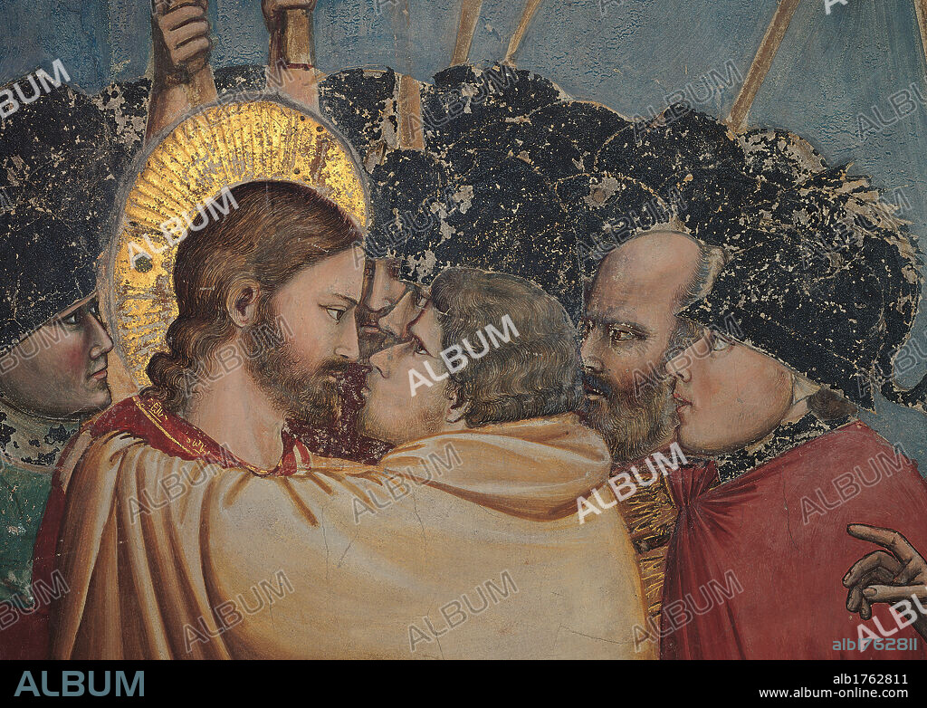 Stories of the Passion The Kiss of Judas, by Giotto, 1303-1306 about, 14th Century, fresco, cm 200 x 185. Italy, Veneto, Padua, Scrovegni Chapel. Stories of the Passion Judas Kiss close up Jesus and Judas soldiers helmets aureole halo lances spears black gray red brown gold.