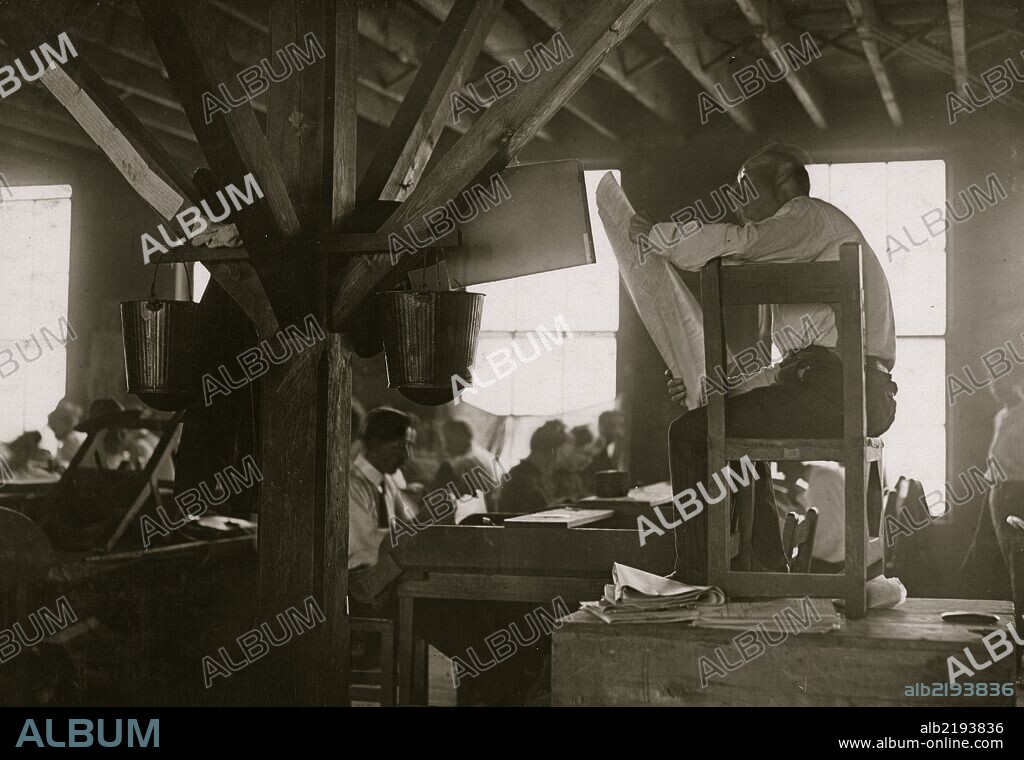 A "Reader" in cigar factory, Tampa, Fla. He reads books and newspapers at top of his voice all day long. This is all the education many of these workers receive. He is paid by them and they select what he shall read.