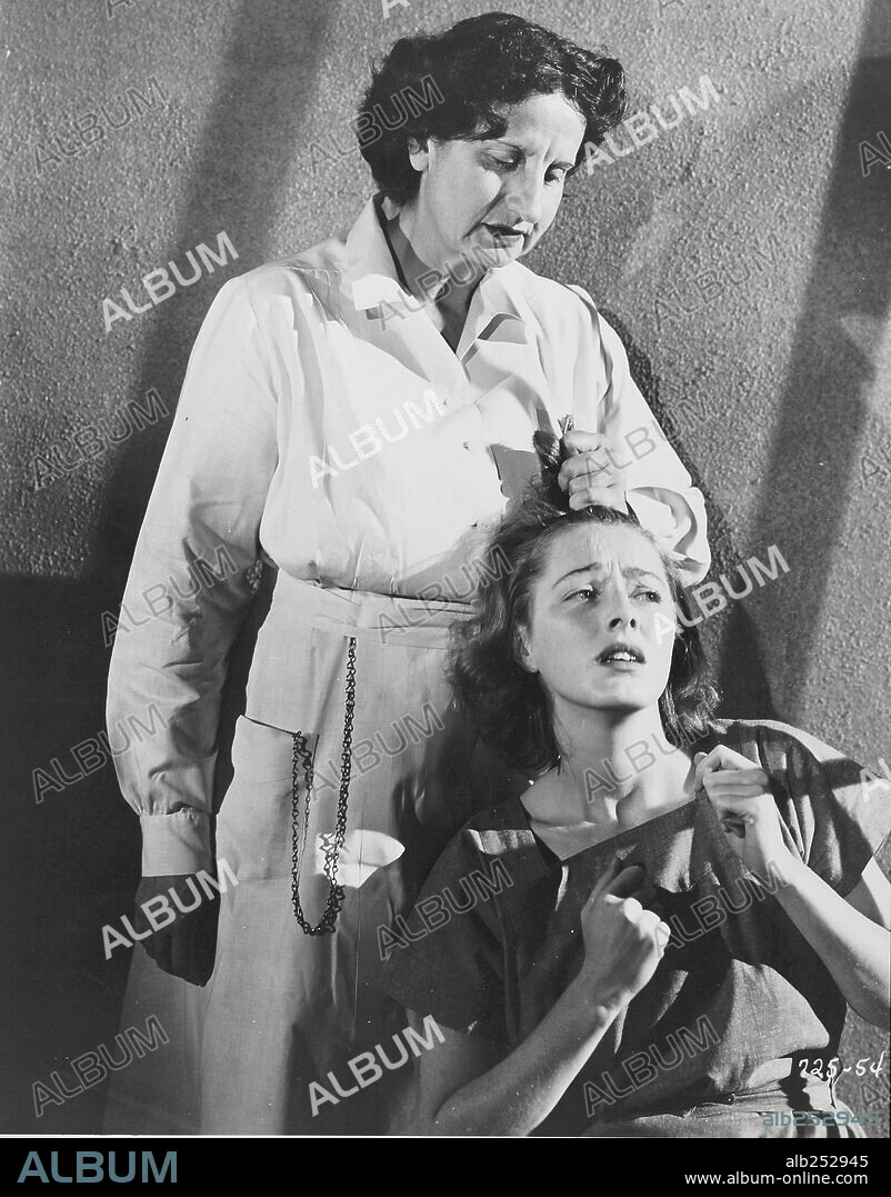 Eleanor Jane Parker and HOPE EMERSON. ELEANOR PARKER and HOPE EMERSON in CAGED, 1950, directed by JOHN CROMWELL. Copyright WARNER BROTHERS.