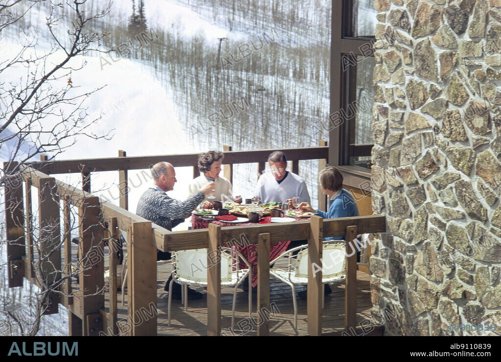 Former U.S. Secretary of Defense Robert McNamara with his wife Margaret and unidentified couple having lunch on Balcony, Snowmass Village, Colorado, USA, Toni Frissell Collection, February 1969.