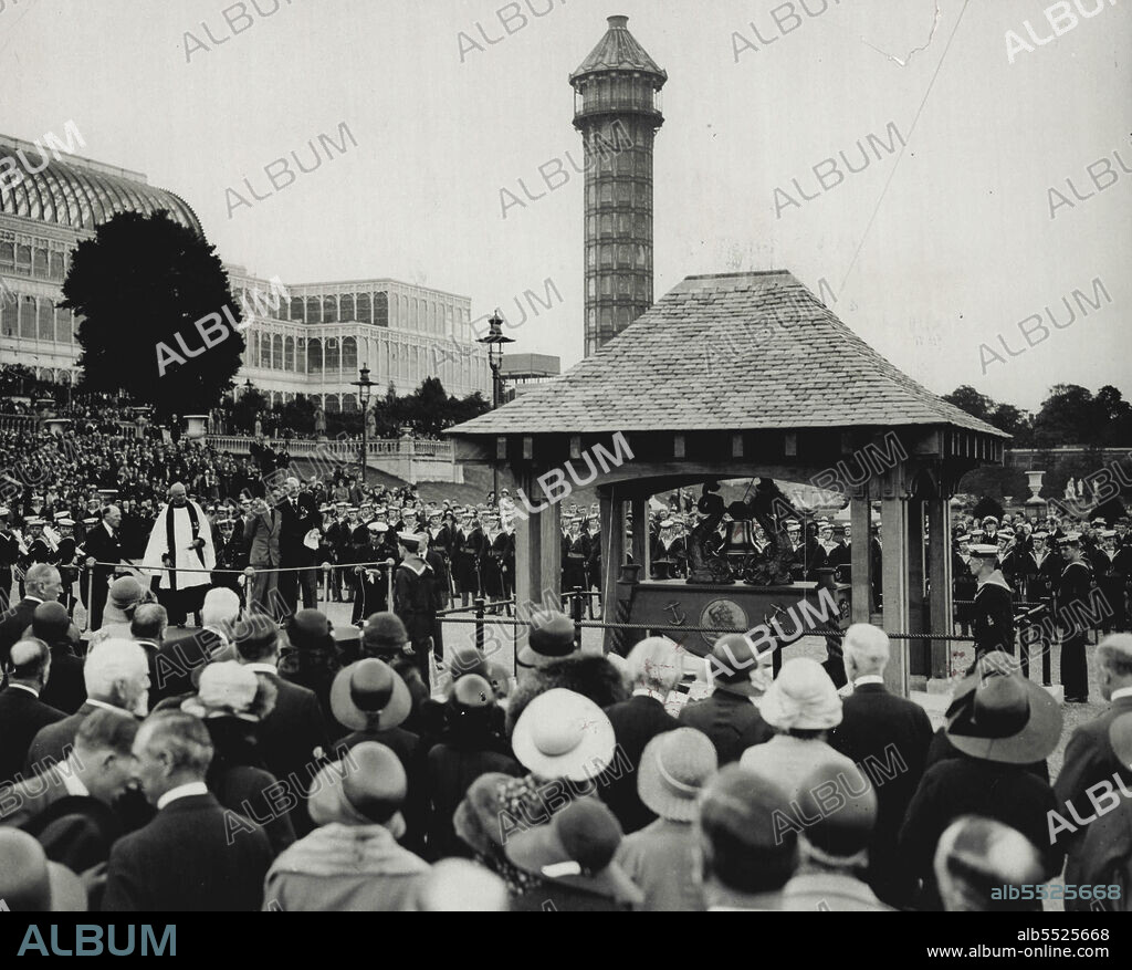 Unveiling Of Memorial At HMS "Crystal Palace" - A photograph taken at the Crystal Palace during the unveiling by the Prince of Wales of the memorial trophy-battleship's bell - to the 125,000 officers and men of the Royal Naval volunteer Reserve who were trained there during the war, when the building was given the name of H.M.S. "Victory VI". It shows the Prince performing the ceremony on a platform in front of the memorial on the Terrace, or "Quarter Deck", as it was known. July 27, 1931. (Photo by Central Press).