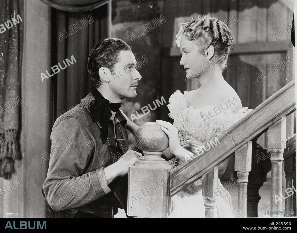 ERROL FLYNN y MIRIAM HOPKINS en ORO, AMOR Y SANGRE, 1940 (VIRGINIA CITY), dirigida por MICHAEL CURTIZ. Copyright WARNER BROS/FIRST NATIONAL.