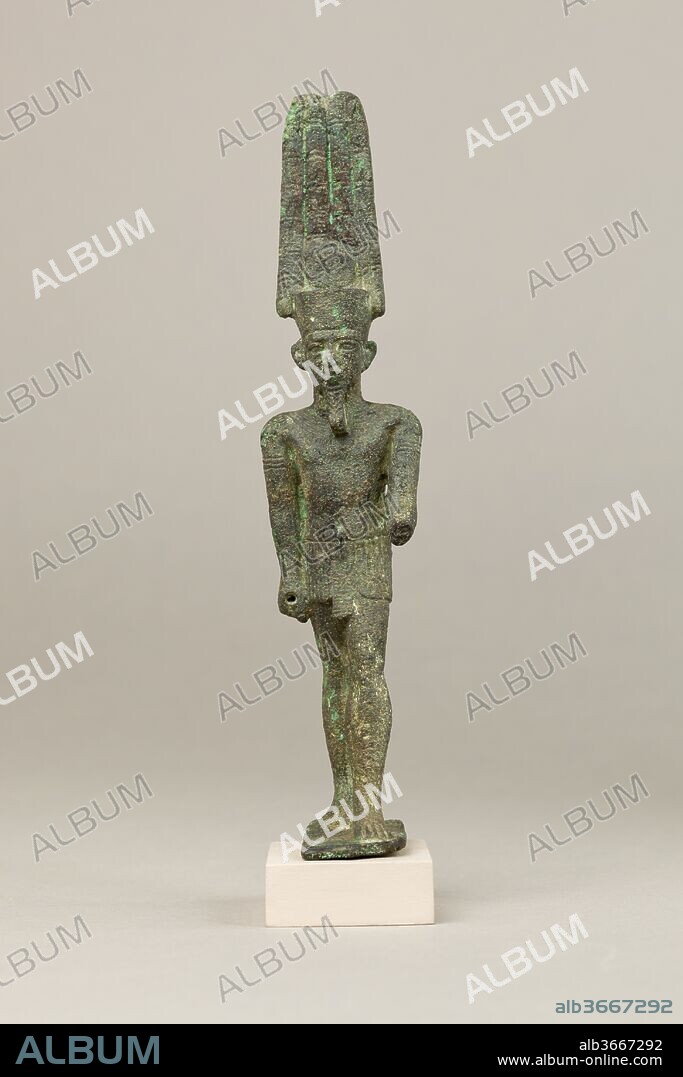 Amun. Dimensions: H. 15.7 cm (6 3/16 in.); W. 3.3 cm (1 5/16 in.); D. 5.2 cm (2 1/16 in.). Date: 664-30 B.C..
Amun was one of Egypt's most celebrated deities, worshipped as a universal, cosmic god and frequently called the king of the gods. In copper alloy he is almost invariably shown, as here, in anthropomorphic form wearing a short kilt and a tall double feather crown with a sun disc, which alludes to his solar and cosmic aspects, including his conflation with the sun god Re. Further elaborations on this statuette include a broad collar and arm bands. His right hand is socketed for the attachment of an attribute. 
Amun gained tremendous popularity in the New Kingdom when he became a kind of national god, and this continued into later periods. His cult originated in Thebes and his temple at Karnak remains one of the most stunning achievements of Egyptian cult and architecture, but he was worshipped in temples and shrines throughout Egypt. In the first millennium BC, statuettes of Amun were offered at many sites throughout Egypt, perhaps in part because, according to some common epithets, he was considered to be a god who listened to and helped his people.
