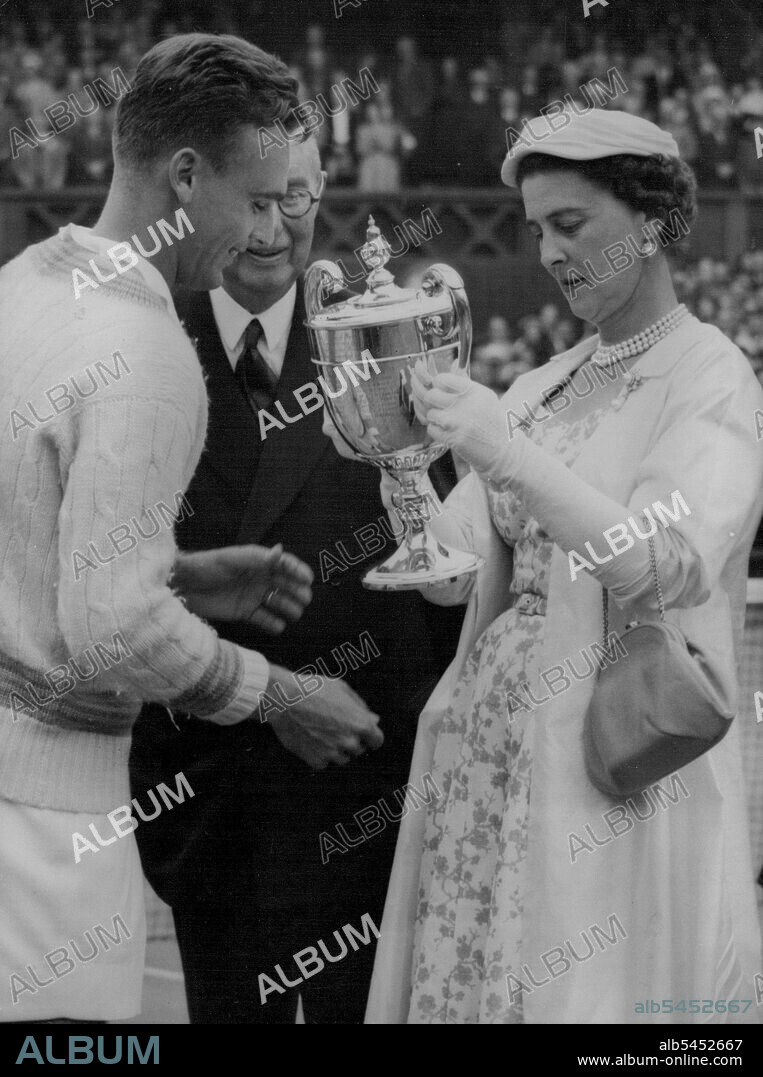 Seixas Wins Singles :The Duchess of Kent reads the inscription on the trophy as she presents it to Vic Seixas of Philadelphia for his Men's Singles Championship victory on Wimbledon's famous centre court today July 3.Seixas defeated Kurt Nielsen of Denmark 9-7, 6-3, 6-4 in the final. July 05, 1953. (Photo by Associated Press Photo).