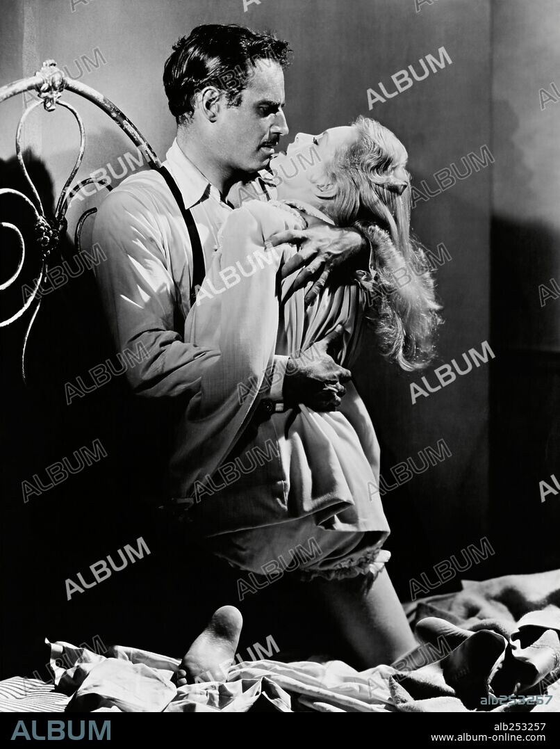 CHARLTON HESTON and JANET LEIGH in TOUCH OF EVIL, 1958, directed by ORSON WELLES. Copyright UNIVERSAL PICTURES.