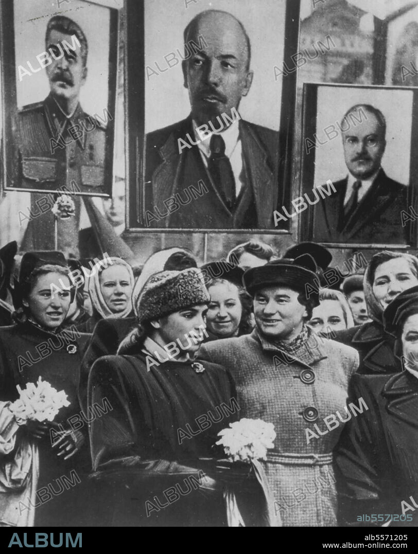 Parade In Moscow's Red Square -- Women workers of a Moscow electric bulb factory carry portraits of Premier Joseph Stalin (left) Nicolai Lenin (center) and deputy premier Vyacheslav Molotov during parade in the Russian capital's Red Square. The size of Molotov's portrait was visual indication that he had risen to new heights of favor in the Kremlin. November 14, 1950. (Photo by AP Wirephoto).