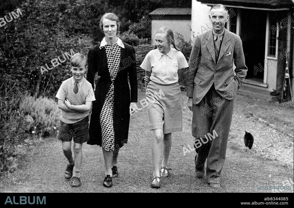 General Percival Back In England - Singapore Commander Rests at Hertfordshire After Secret Arrival -- General Percival with his wife, and his son James, aged 8½ years and his daughter Margery, aged 15½ years, walking in the garden of their home in Hertfordshire.Lieutenant General Arthur Ernest Percival CB; DSO; OBE; MC. British commander at the fall of Singapore, has arrived secretly in this country after his release from 3½ years captivity in a Japanese prison camp in Manchuria, and is now resting with his wife and children at his home in Hertfordshire. September 12, 1945.