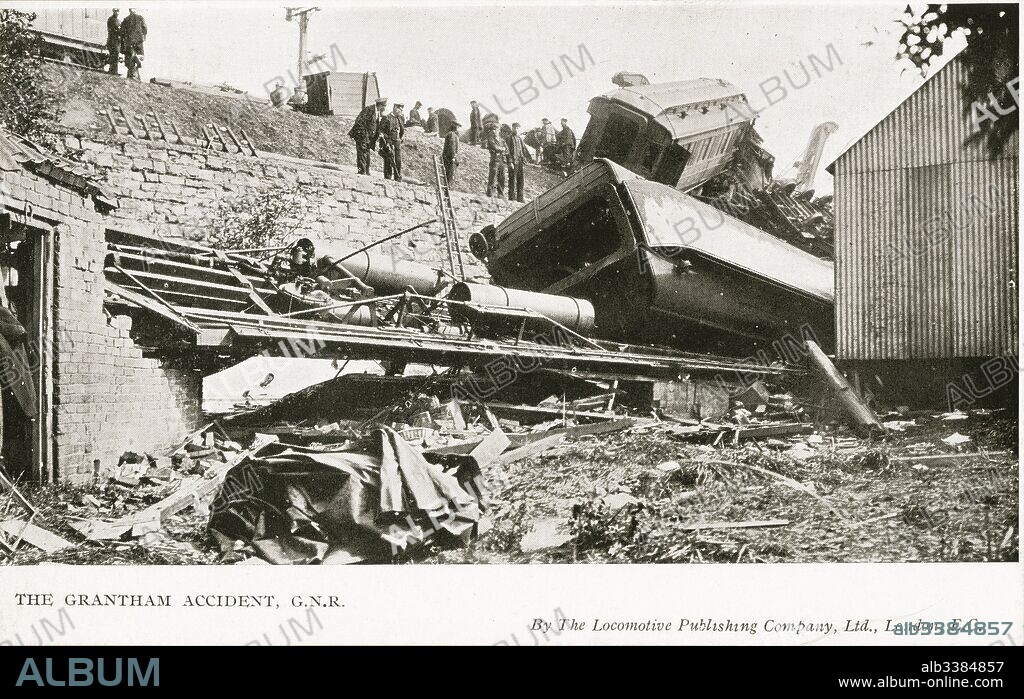 The Grantham accident, overturned carriages and debris. An evening sleeping-car and mail train from London Kings Cross to Edinburgh Waverley hauled by Ivatt "Atlantic" No 276 derailed, killing 14. The accident occurred in mysterious circumstances; the train ran right through Grantham station, where it was scheduled to stop, and derailed on a sharp junction curve at the end of the platform, which at the time had been set for the passing of a freight train; no definite cause was ever established as to why the train did not stop as scheduled or obey the signals at Caution and Danger.