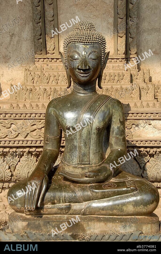 Theravada Buddhism, ancient Buddha statue in bronze in meditation, Bhumisparsha Mudra, Bhumisparshamudra, gesture to call upon the earth, Haw Pra Kaeo museum, Vientiane, Laos, Southeast Asia, Asia.