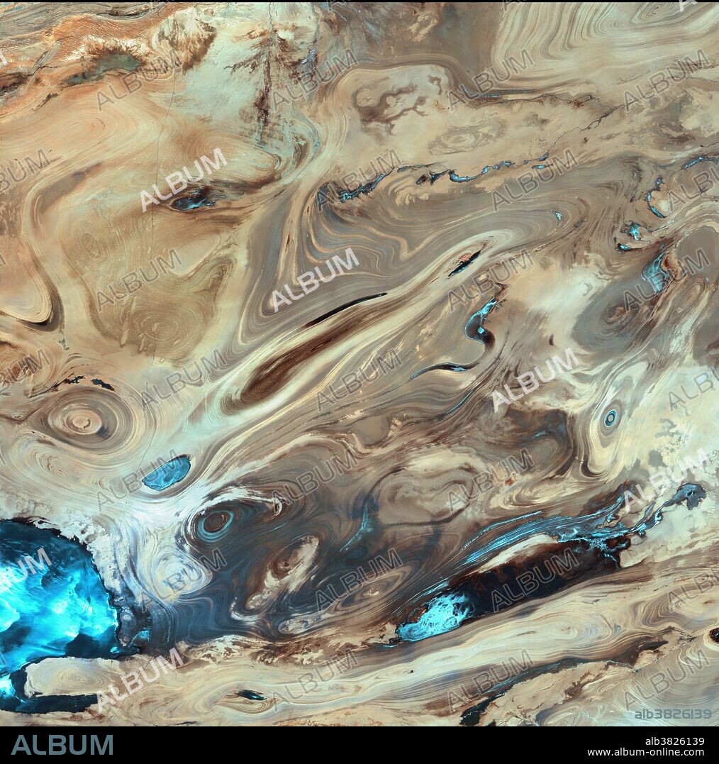 The Dasht-e Kavir, or Great Salt Desert, is the largest desert in Iran. It is a primarily uninhabited wasteland, composed of mud and salt marshes covered with crusts of salt that protect the meager moisture from completely evaporating. Image Date: October 2000.