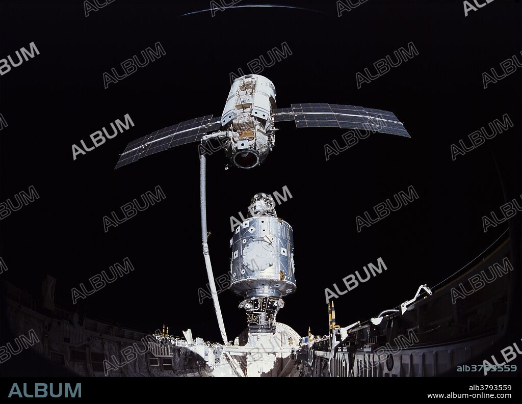 In December 1998, the crew of Space Shuttle Mission STS-88 began construction of the International Space Station, joining the U.S.-built Unity node to the Russian-built Zarya module. The crew carried a large-format IMAX camera from which this picture was taken. - With Unity in place, Astronaut Nancy Currie begins positioning Zarya for mating. STS-88 was the first Space Shuttle mission to the International Space Station (ISS). It was flown by Space Shuttle Endeavour, and took the first American module, the Unity node, to the station. The 7 day mission was highlighted by the mating of the US built Unity node to the Functional Cargo Block (Zarya module) already in orbit, and three spacewalks to connect power and data transmission cables between the Node and the FCB. Zarya, built by Boeing and the Russian Space Agency, was launched on a Russian Proton rocket from the Baikonur Cosmodrome in Kazakhstan in November 1998.