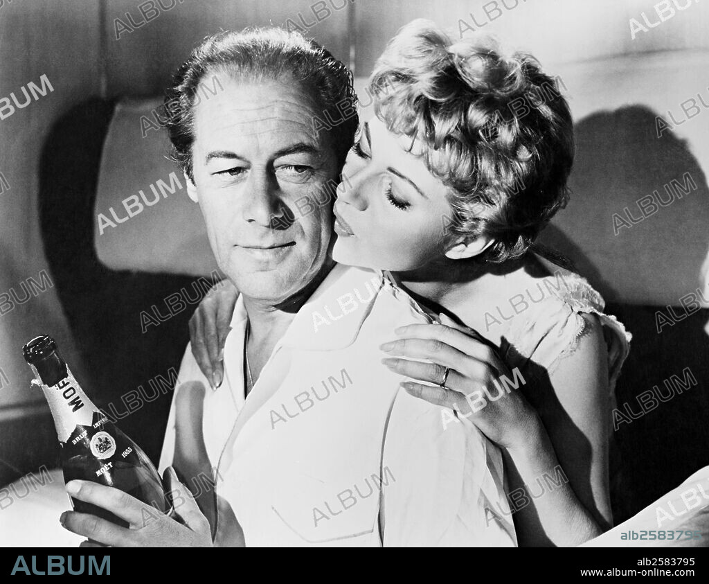 REX HARRISON and RITA HAYWORTH in THE HAPPY THIEVES, 1961, directed by GEORGE MARSHALL. Copyright HILLWORTH.