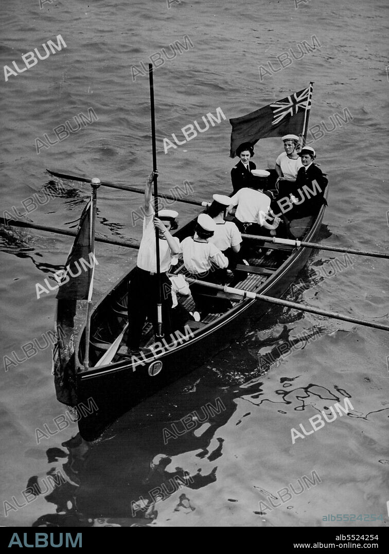 Princess Visits Portsmouth -- Seated in the stern of a boat as they are rowed to the "Wooden Wall" Frigate Foudroyant at Portsmouth, England, May 19, are Princess Margaret (stern, left) and Miss S. G. Olarke, assistant commodore of the Sea Rangers.The Princess is wearing the uniform of Commodore of the Rangers.The frigate is now the Rangers training headquarters. May 19, 1950. (Photo by Associated Press Photo).
