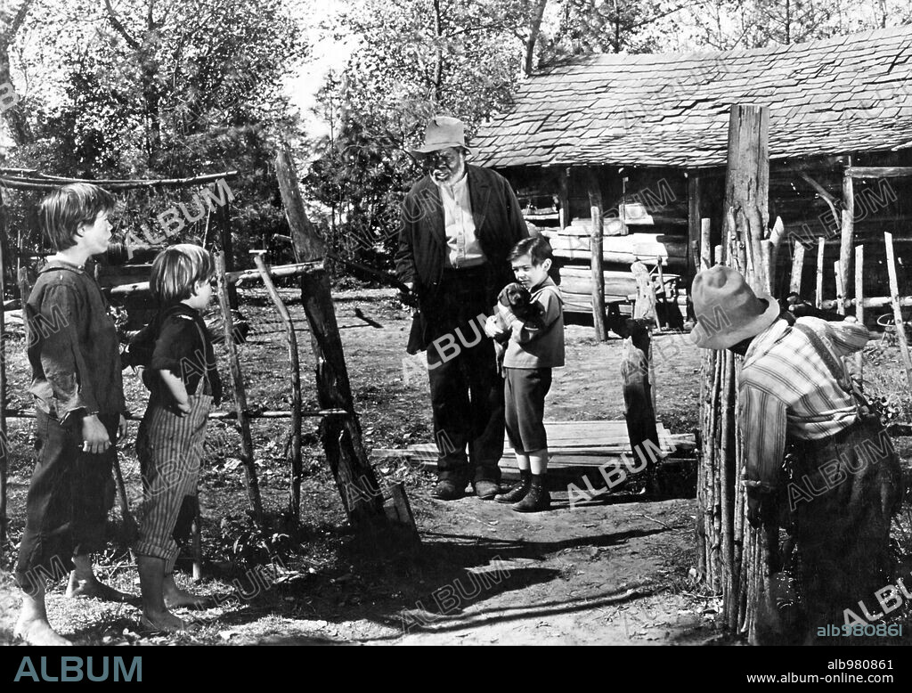 BOBBY DRISCOLL and JAMES BASKETT in SONG OF THE SOUTH, 1946, directed by HARVE FOSTER and WILFRED JACKSON. Copyright RKO RADIO PICTURES.