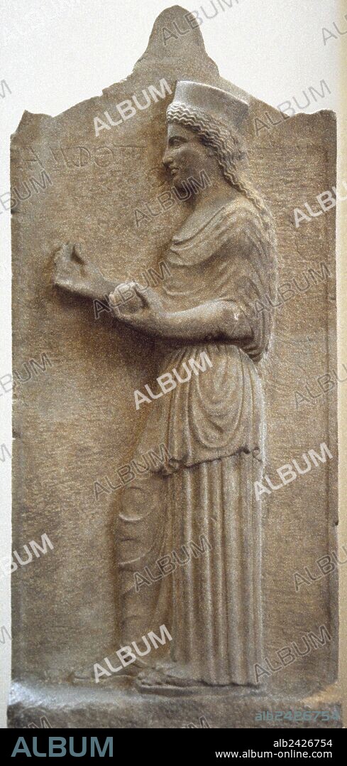 Greek Art. Classical Era. Grave stele of Amphotto, from Thebes, 440 B.C. Boetian limestone. The dead woman is depicted facing left and holding a flower in the right hand and a fruit in the left. National Archaeological Museum. Athens. Greece.