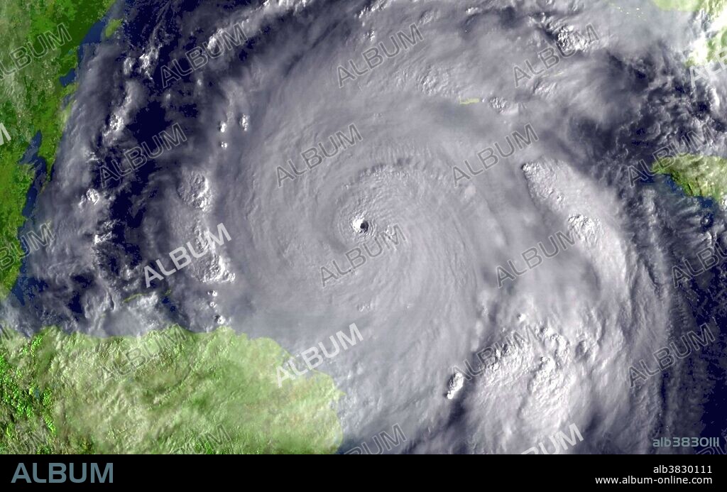 This image was taken by the GOES-12 satellite on October 19, 2005, as the storm approached Cancun and Cozumel, Mexico. Hurricane Wilma was the most intense tropical cyclone ever recorded in the Atlantic basin. Part of the record breaking 2005 Atlantic hurricane season, which included three of the six most intense Atlantic hurricanes ever (along with #4 Rita and #6 Katrina), Wilma was the 22nd storm, 13th hurricane, 6th major hurricane, 4th Category 5 hurricane, and 2nd most destructive hurricane of the 2005 season. A tropical depression formed in the Caribbean Sea near Jamaica on October 15, and intensified into a tropical storm two days later, which was named Wilma. After heading westward as a tropical depression, Wilma turned abruptly southward after becoming a tropical storm. Wilma continued intensifying, and eventually became a hurricane on October 18. Shortly thereafter, extreme intensification occurred, and in only 24 hours, Wilma became a Category 5 hurricane with winds of 185 mph. Wilma is ranked among the top five most costly hurricanes ever recorded in the Atlantic and the fifth costliest storm in United States history.