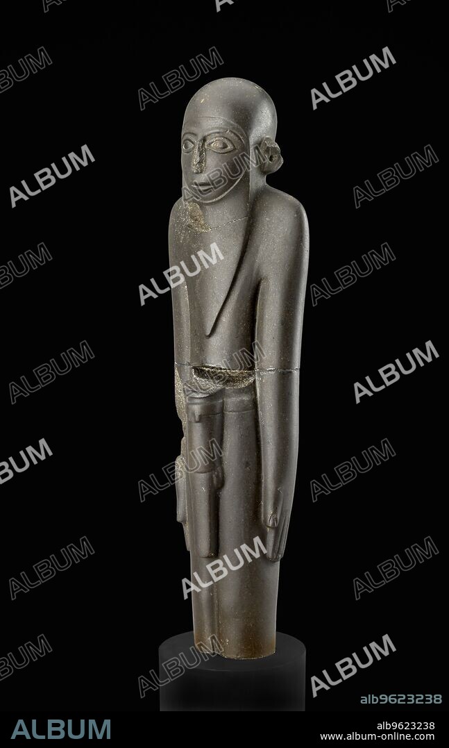 Statue (MacGregor Man), Predynastic Period (Egypt),  c3100 BC. Standing man, arms by sides with hands open, palms in, legs together. Details of eyes, eyebrows, and mouth clearly shown; nose and ears damaged, ears originally prominent with bored ear-holes. Long, pointed beard on chest; outline of beard shown, and hair. Dimension: thickness: 39.5 cm thickness or height.