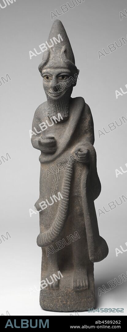 Priest-King or Deity, c. 1600 BC. The Hittites migrated into Anatolia in the 3rd millennium BC and spoke an Indo-European language, a group that includes Greek, Latin, Persian, Sanskrit, English, and most modern European languages. They were the first ancient people to use iron for weapons. From about 1600-1200 BC their empire was at its peak, extending from central Anatolia to Syria, and south along the eastern Mediterranean. Their vast empire and interest in commerce enabled the Hittites to spread Mesopotamian ideas and culture throughout the ancient Mediterranean world. This large basalt sculpture is exceptionally rare in depicting a Hittite god or priest-king wearing a horned conical crown, false beard, and long robe. He holds a bowl in his right hand and once held something in his left, perhaps a staff or sword.
