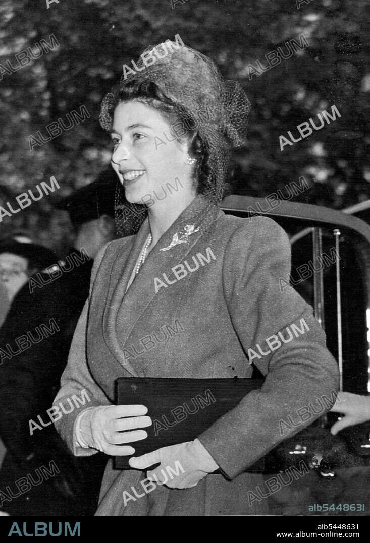 Princess Elizabeth Has A Busy Day: Goes To Reception Following Wedding - And Attending State Opening of Parliament In London -- Princess Elizabeth arriving at the Savoy Hotel, London, for the reception following the wedding. After attending her first State opening of Parliament, where the Princess had followed the King and Queen in a glass coach during the procession to the wedding at St. Martin's-in-the-Fields Church, between the Hon David Alan Bethell M.C. Scots Guards, and Miss Ursula James, elder daughter of he Hon. Robert and Lady Serena James, of Richmond, Yorkshire, and afterwards was present at the reception at the Savoy Hotel. October 21, 1947.