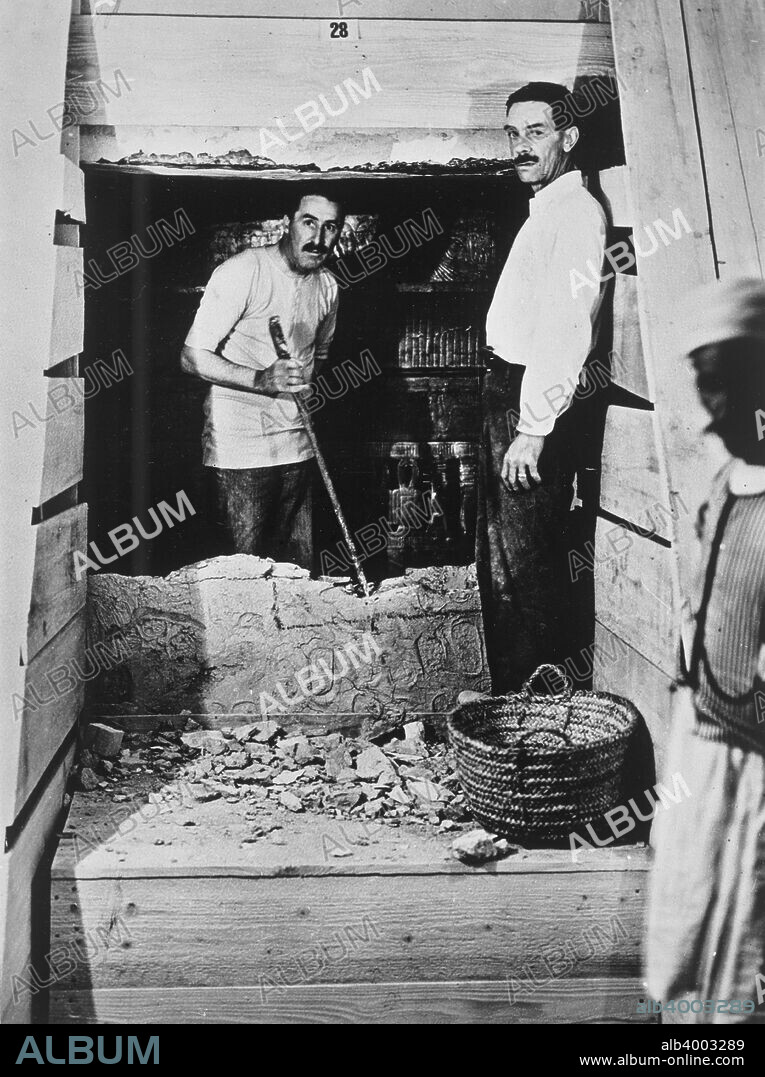 Howard Carter and a colleague excavating a tomb in the Valley of the Kings, Egypt, 1922. Carter and another archaeologist standing beside a partially demolished wall to one of the tombs. He famously discovered the intact tomb of the Pharaoh Tutankhamun in 1922.