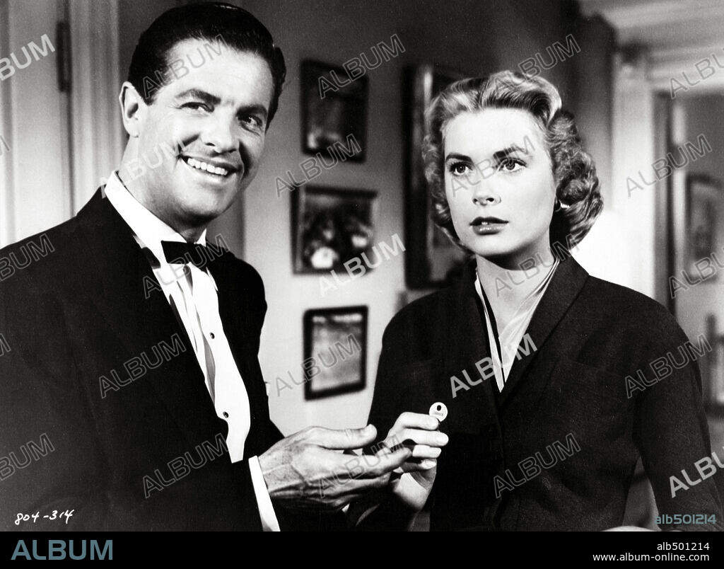GRACE KELLY and ROBERT CUMMINGS in DIAL M FOR MURDER, 1954, directed by ALFRED HITCHCOCK. Copyright WARNER BROS.