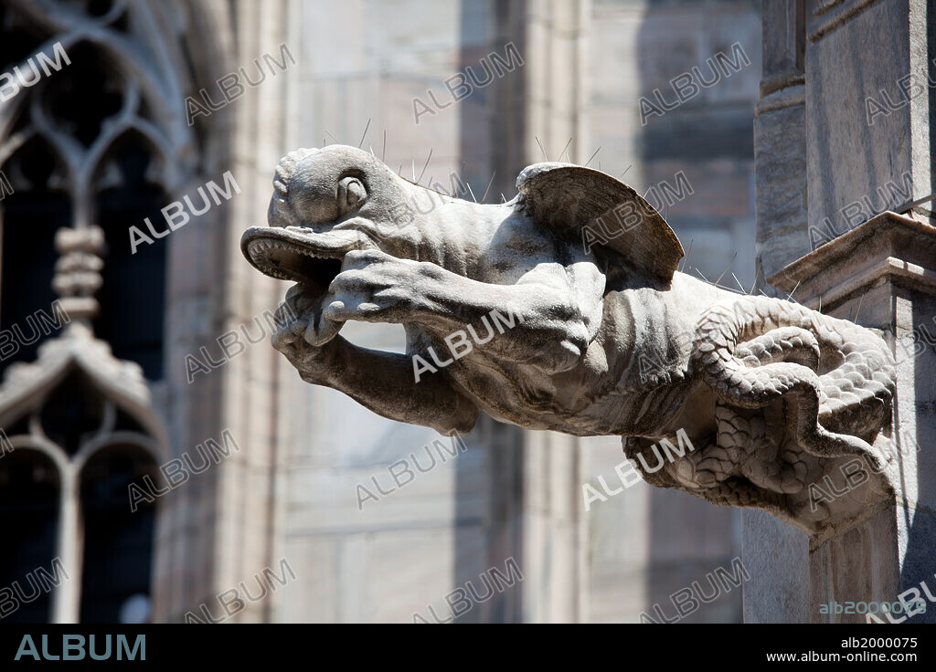 Italy, Milan, Milan Cathedral, Gargoyles. Made in the typical stone used in Gothic cathedral architecture, they are made in the shapes of animals belonging to the medieval bestiary, grotesques or, more rarely, in human form. They are a widely diffused sculptural feature in the Milan Cathedral and are found on the spires and smaller terraces and as part of the large ones, along the outside of the building.