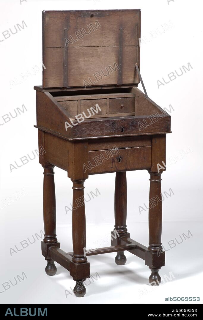 lectern, Anonymous, 17th century, metal, oak, Oak lectern on a base with a protruding sloping flap and a new ledge. The lid of the lectern is hinged to the top frame. The desk contains two side-by-side oval bent metal lock plates with protrusions. The base stands on Doric columnar and twisted articulation and houses with a double T-shaped connection in between. The base is on ball legs. Along the top edge of the chassis run sawn-out S-shaped volutes and consoles at the bottom. The key is missing, General: 124 x 78 x 63cm 1240 x 780 x 630mm.