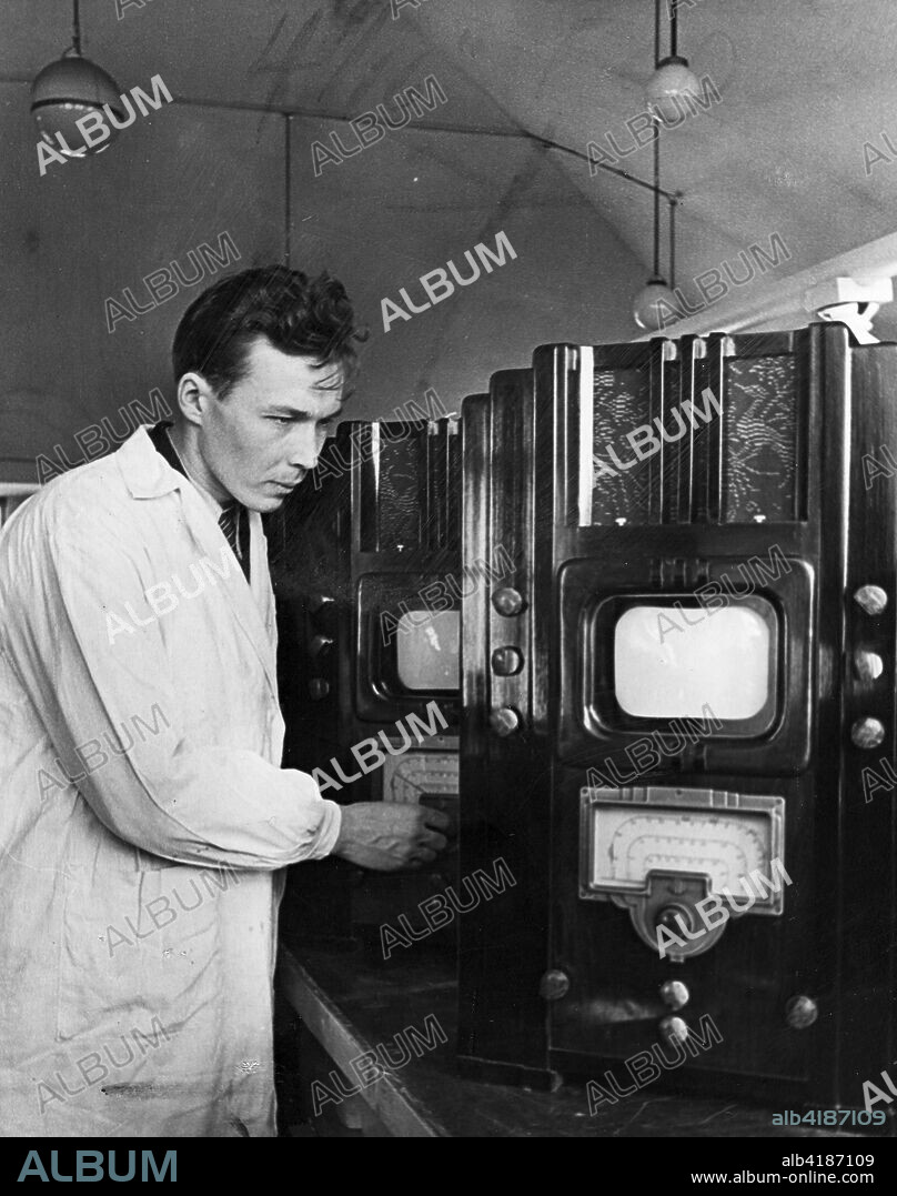 Production of television sets has begun on a commercial scale in the Soviet Union. A. Klopov , the chief engineer of the 'Radist' Laboratory in Leningrad is giving a final inspection of the sets that are ready for shipment to retail stores. Late 1940s.