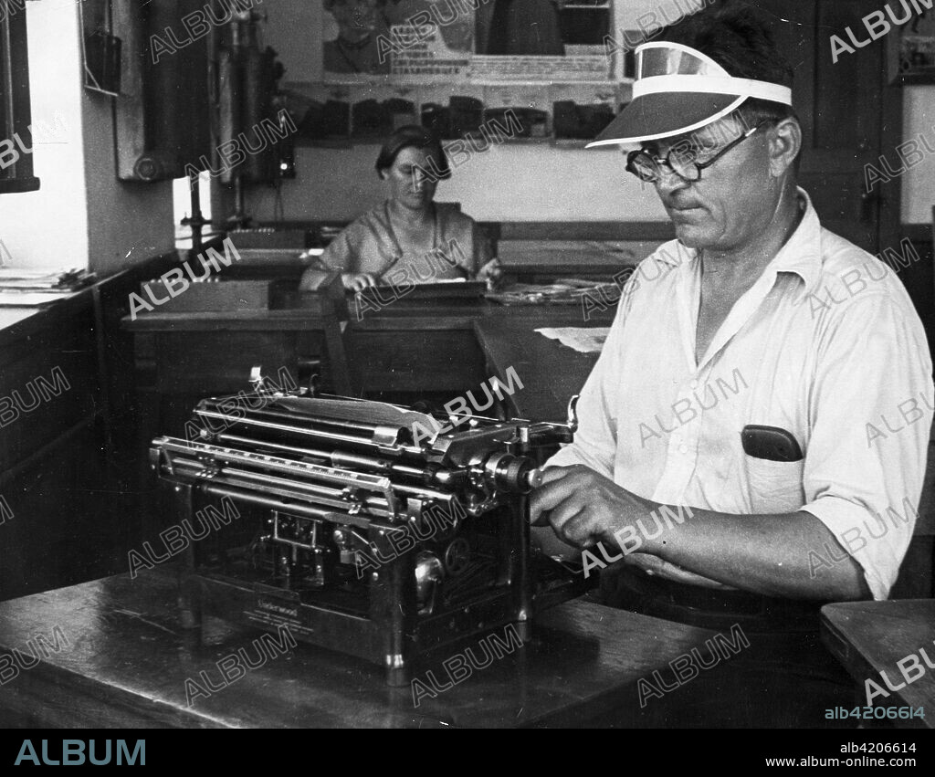 December 1937. The secretary of the 'Soyatel' (Sower) Collective collective farm in the Azov-Black Sea Territory at the typewriter.