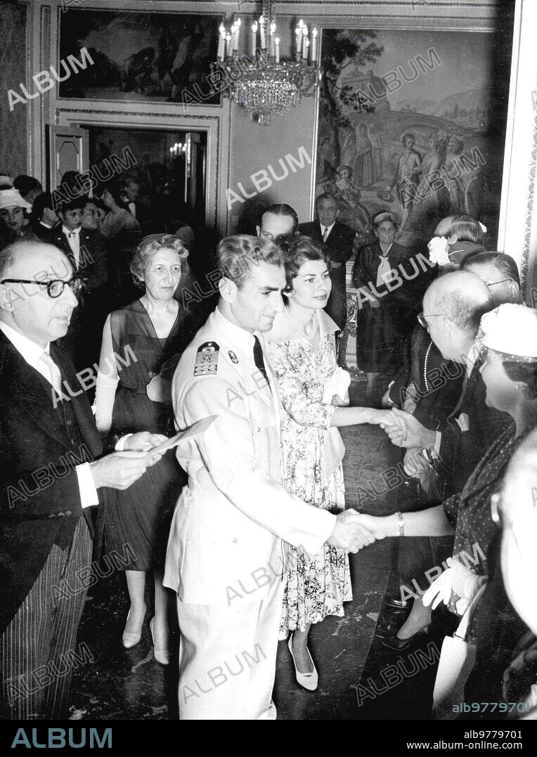 May 22, 1957. Emperors Mohamed Reza Pahlevi and Soraya of Iran greet the members of the Diplomatic Corps accredited in Madrid, during the reception offered yesterday by Their Imperial Majesties at the Moncloa Palace.