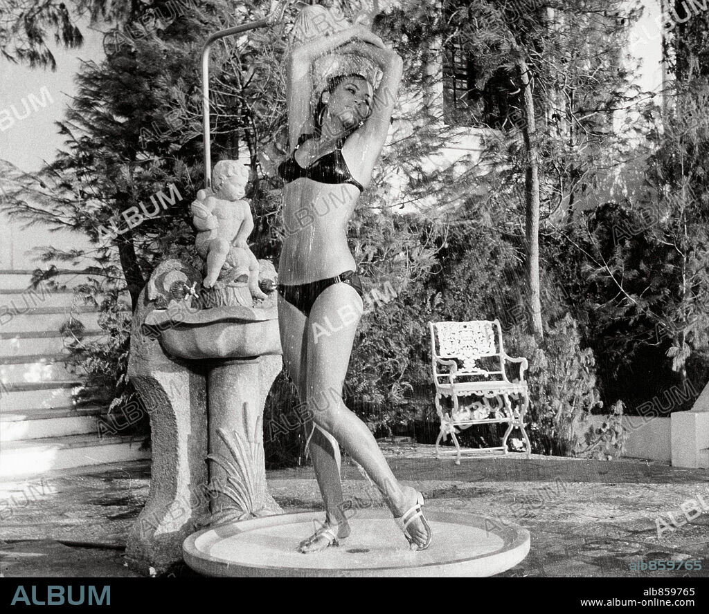 SILVIA MONTI in LE CERVEAU, 1969, directed by GERARD OURY. Copyright PARAMOUNT PICTURES.