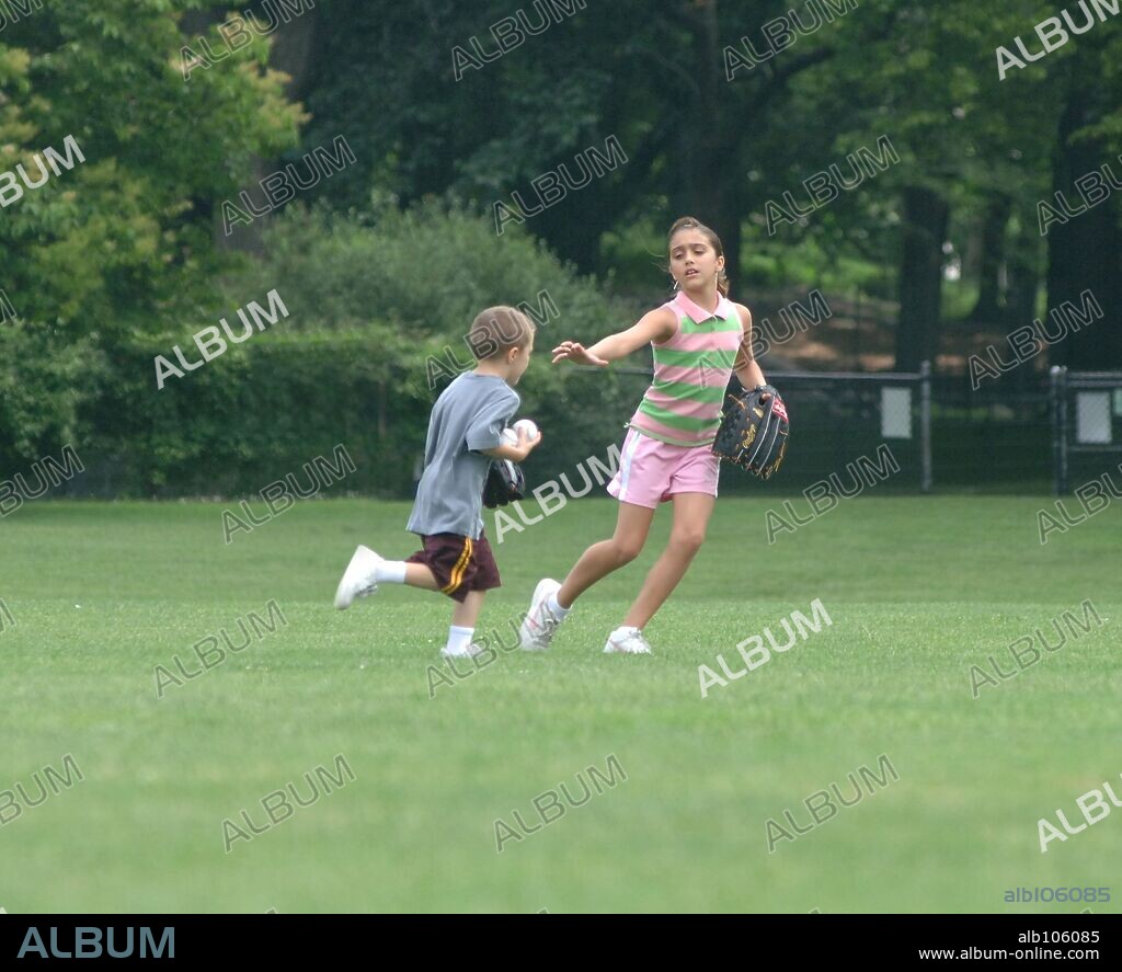 LOURDES LEON and ROCCO RITCHIE. June 27 2006, New York City Madonna's children Rocco (5) and Lourdes (9) spend the morning in Central Park with their nanny and bodyguard. The two children played catch, baseball, threw frisbe's and did cartwheels. 28/06/2006