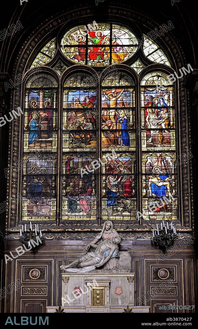 Pietà in front of stained glass window in the church of Saint Eustache, Église des Halles, Paris, France, Europe.